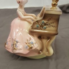 Porcelain Girl playing piano with wind up music